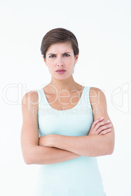 Angry woman looking at camera with arms crossed