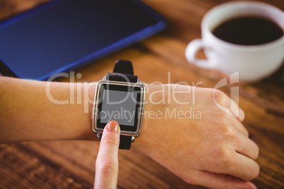 Woman using her smartwatch