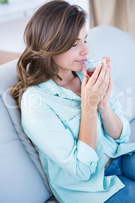 Peaceful woman drinking cup of tea