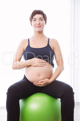 Pregnant woman keeping in shape