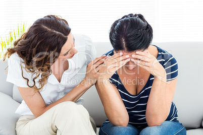 Therapist comforting her patient