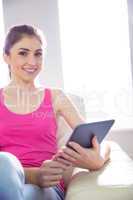 Casual woman using her tablet pc