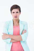 Angry woman with arms crossed looking at camera