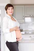 Pregnant woman holding her bump