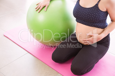 Pregnant woman keeping in shape