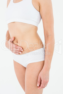 Fit woman suffering from stomach pain