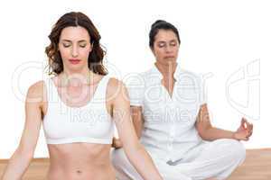 Women sitting in lotus pose