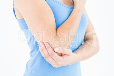 Woman touching her painful elbow