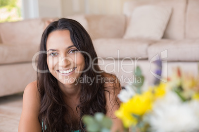 Pretty brunette lying on the floor