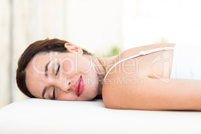 Calm woman lying on massage table