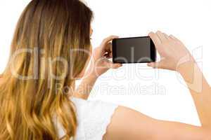 Woman taking a selfie on smartphone