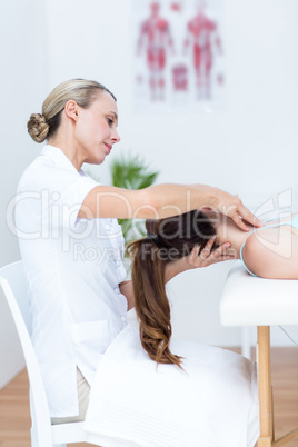 Physiotherapist doing neck massage