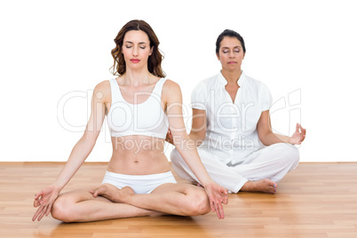 Women sitting in lotus pose