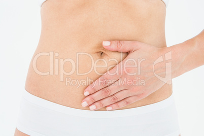 Fit woman touching her painful stomach