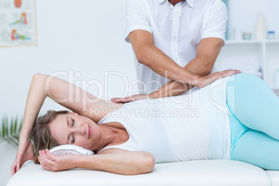 Doctor massaging his patient back