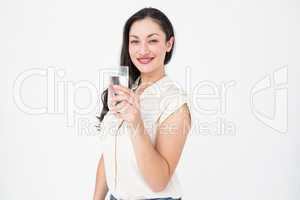 Pretty brunette holding glass of water