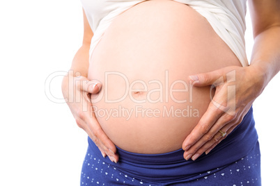 Pregnant woman holding her bump