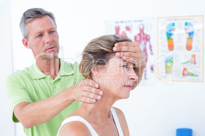 Doctor doing neck adjustment