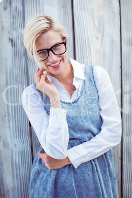 Pretty blonde woman wearing hipster glasses