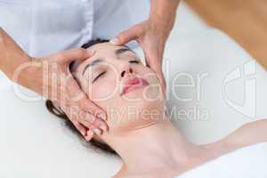 Physiotherapist doing head massage