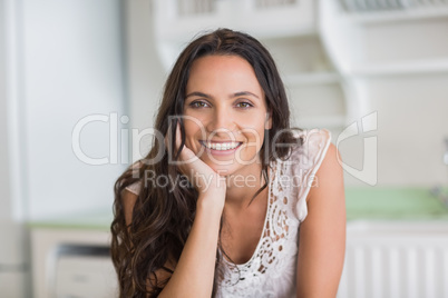 Pretty brunette smiling at camera