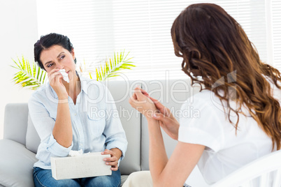 Depressed woman talking with her therapist