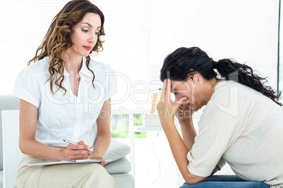 Depressed woman talking to her therapist