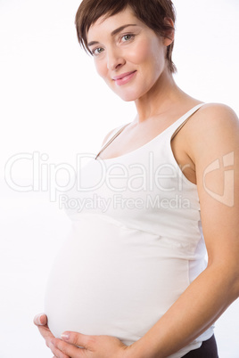 Pregnant woman holding her bump