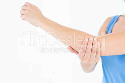 Woman touching her painful elbow