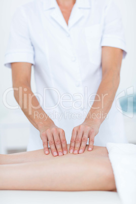 Physiotherapist doing leg massage