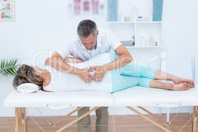 Doctor massaging his patient back