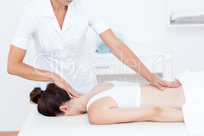 Physiotherapist doing back massage