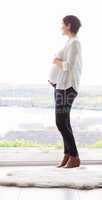 Pregnant woman holding her bump