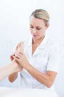 Physiotherapist doing foot massage