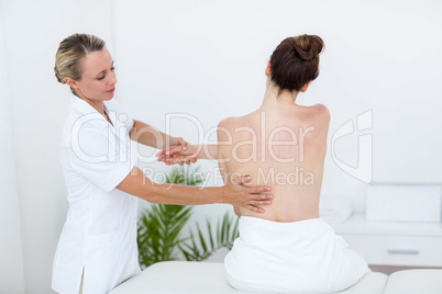 Physiotherapist doing back massage