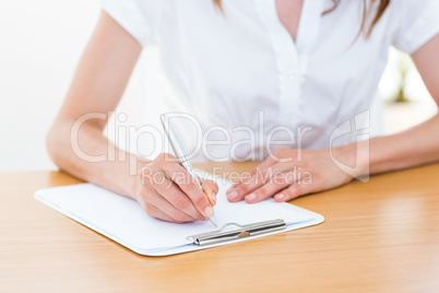 Businesswoman taking notes