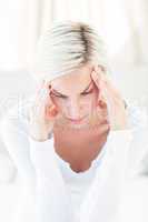 Blonde woman having headache