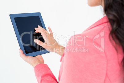 Elegant brunette using tablet