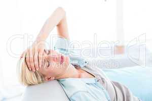 Blonde woman having headache