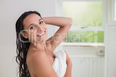 Pretty brunette holding her bath towel