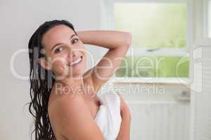 Pretty brunette holding her bath towel