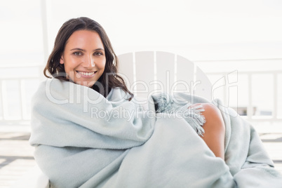 Pretty brunette sitting on a chair