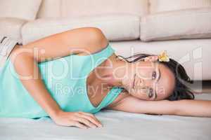 Pretty brunette lying on the floor