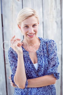 Pretty blonde woman smiling at the camera Pretty blonde woman smiling at the camera