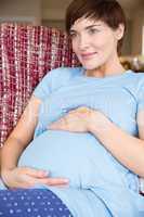 Pregnant woman relaxing on the couch