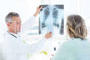 Doctor showing xray to his patient