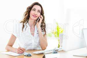 Smiling businesswoman having phone call