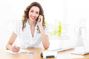 Smiling businesswoman having phone call