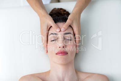 Physiotherapist doing head massage