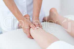 Physiotherapist doing leg massage